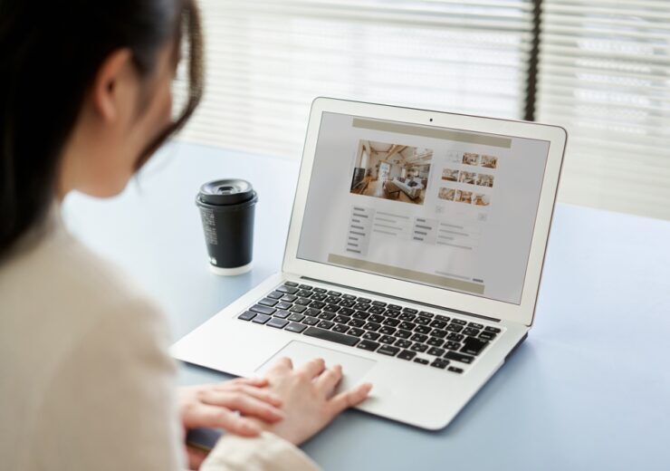 Asian,Women,Viewing,Real,Estate,Websites,On,A,Computer