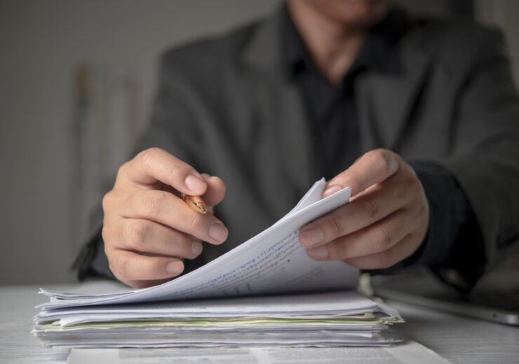 Close,Up,Hands,Lawyer,Reading,Studying,Contract,Paperwork,Holding,Pen